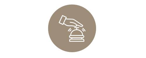 Icon of a hand ringing a bell on a beige circle